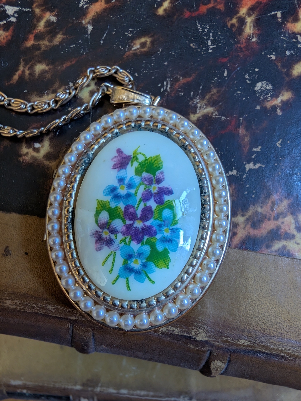 Avon vintage locket with blue/purple violets and green leaves, 26 inch chain